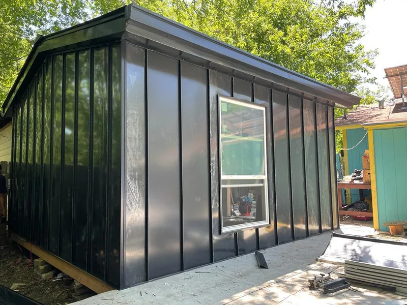 Black standing seam metal wall panels for Metal Roof Installation in Fallsburg