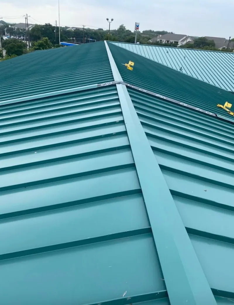 Green commercial metal roof ridge and valley for Metal Roof Repair in Fallsburg